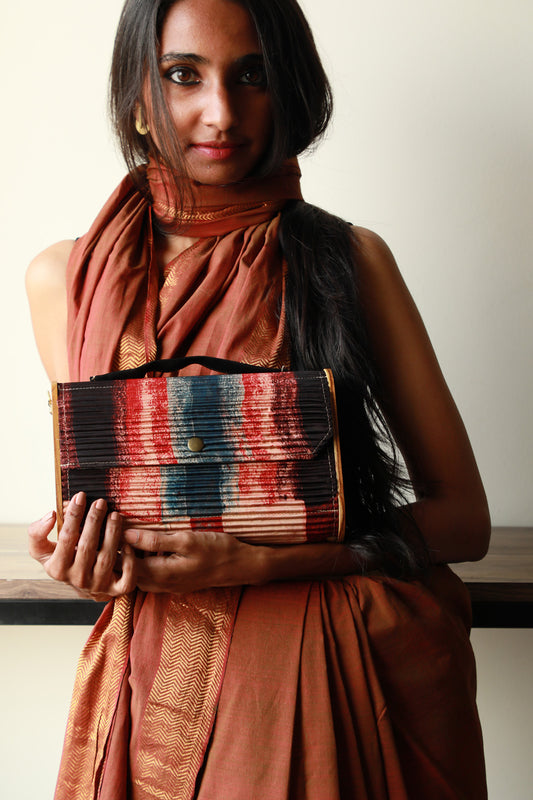 Kinu upcycled Capsule Clutch