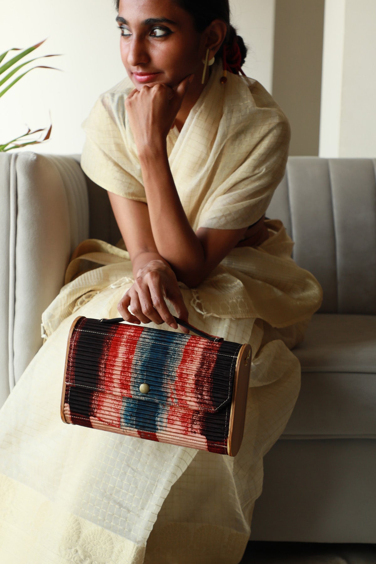 Kinu upcycled Capsule Clutch