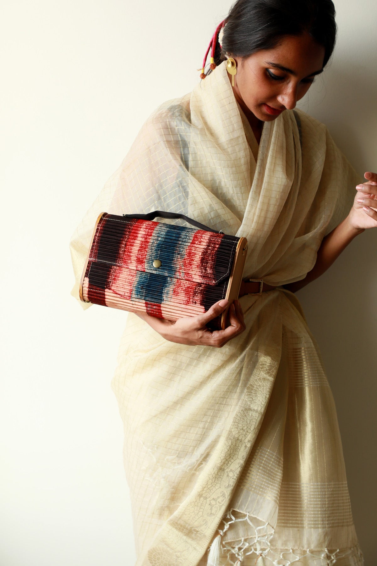 Kinu upcycled Capsule Clutch